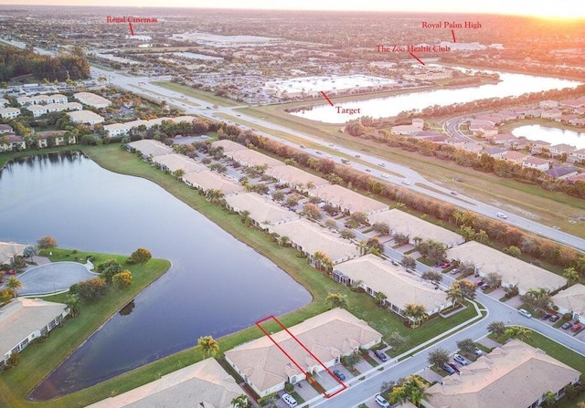 aerial view at dusk with a water view