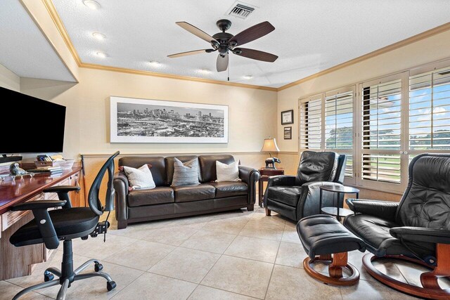 office space with ceiling fan, light tile patterned floors, a textured ceiling, and ornamental molding