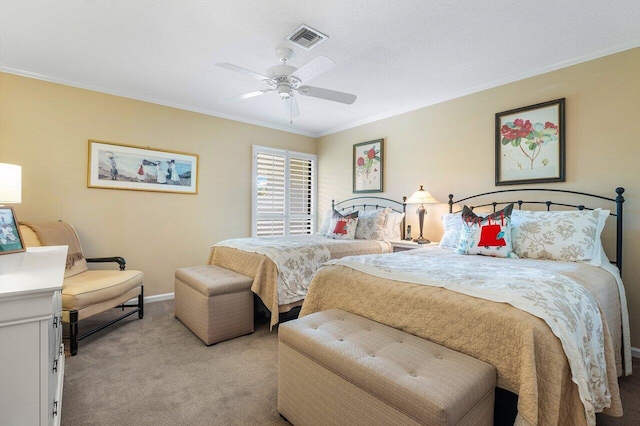 carpeted bedroom featuring ceiling fan, crown molding, and a textured ceiling