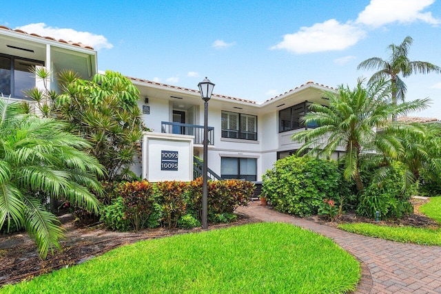 10093 Quail Covey Road Hibiscus N, Boynton Beach, FL 33436 - mediterranean / spanish house featuring a tiled roof and stucco siding