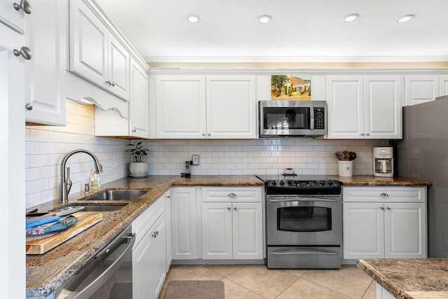 10093 Quail Covey Road Hibiscus N, Boynton Beach, FL 33436 - kitchen featuring stainless steel appliances, white cabinets, light tile patterned floors, tasteful backsplash, and crown molding
