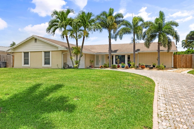 single story home with a front lawn