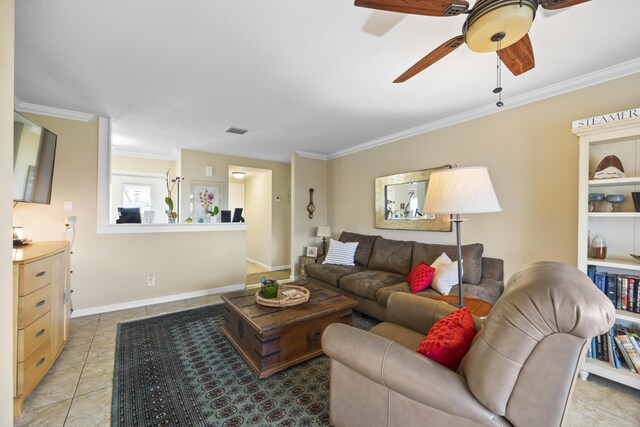 tiled living room with ornamental molding and ceiling fan