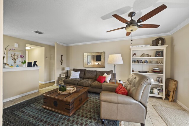 tiled living room featuring crown molding and ceiling fan