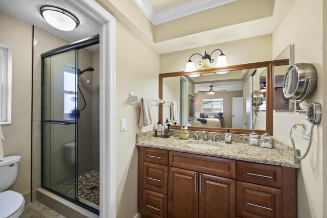 bathroom featuring toilet, vanity, ceiling fan, walk in shower, and crown molding