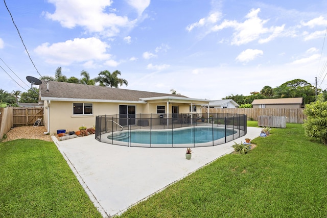 view of pool featuring a yard and a patio area