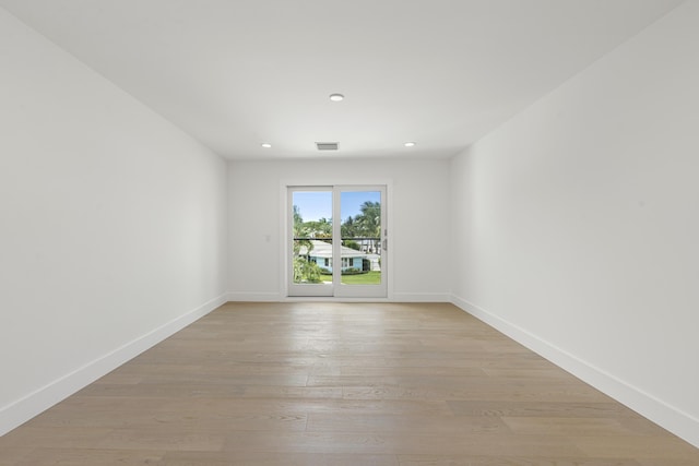 unfurnished room featuring light hardwood / wood-style flooring