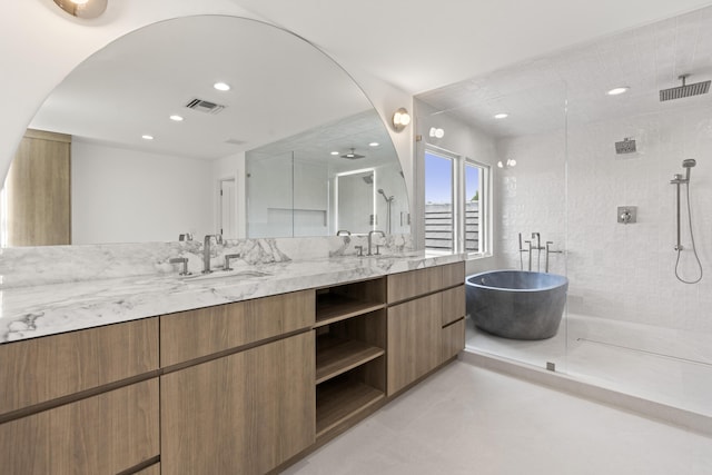 bathroom with tile patterned flooring, vanity, and independent shower and bath