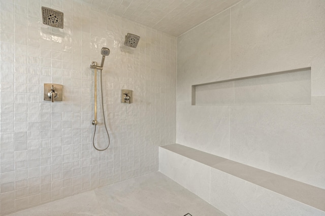 bathroom with a tile shower