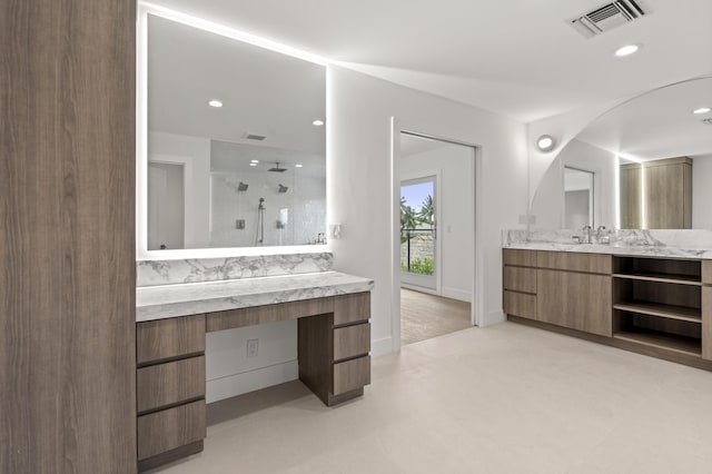 bathroom featuring vanity and walk in shower