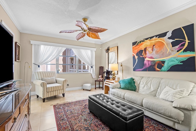 living room featuring ceiling fan, crown molding, a textured ceiling, and light tile patterned floors