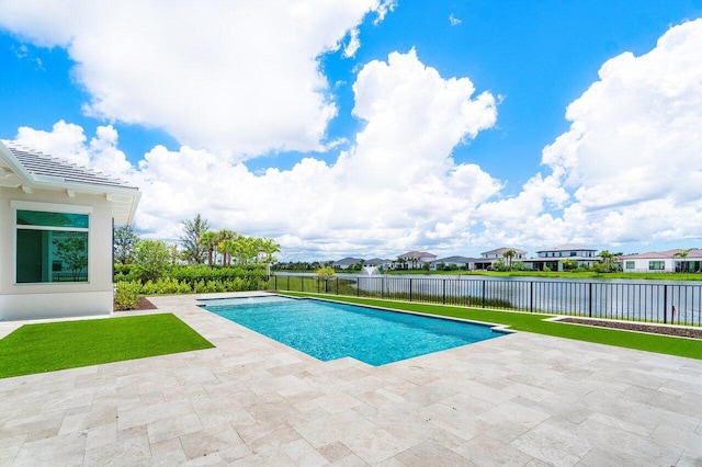 view of pool with a water view and a patio