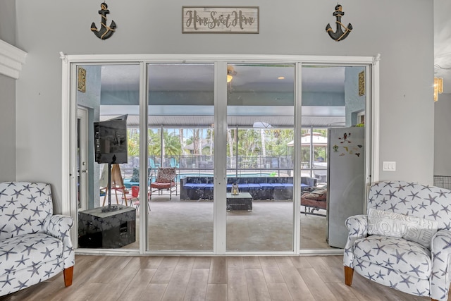 doorway to outside featuring hardwood / wood-style flooring