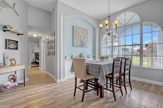 dining space featuring an inviting chandelier