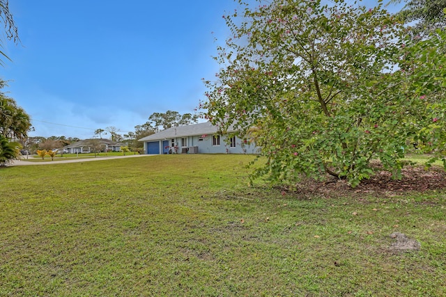 view of yard with a garage