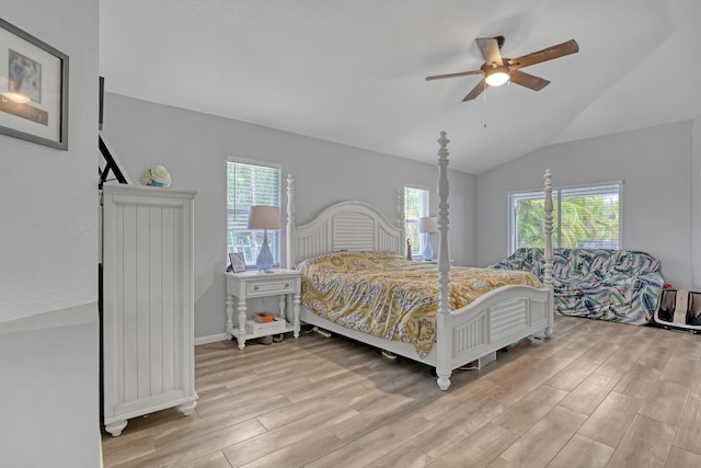 bedroom featuring vaulted ceiling, light hardwood / wood-style flooring, and ceiling fan