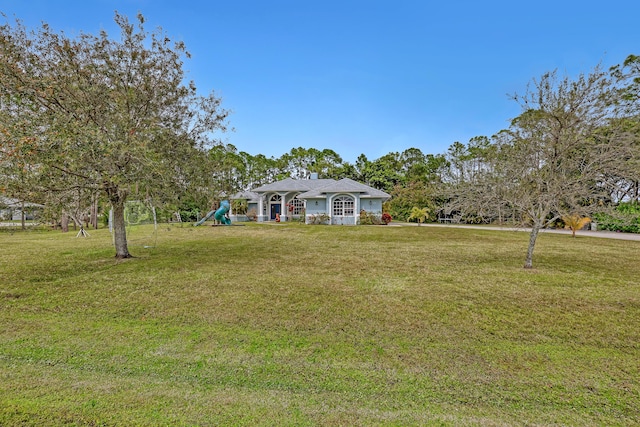 view of front of home with a front yard