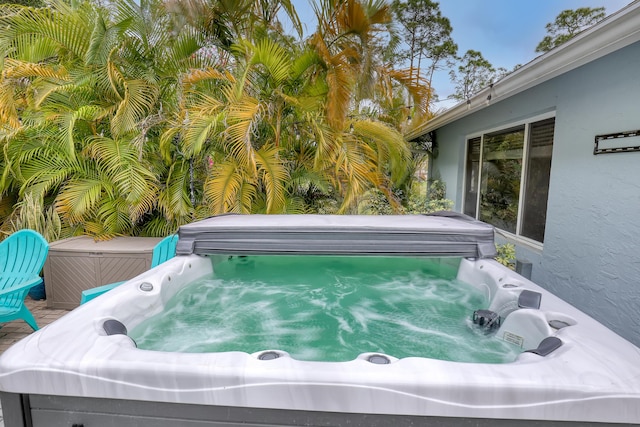 exterior space with a hot tub