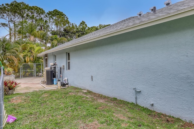 view of home's exterior with a yard