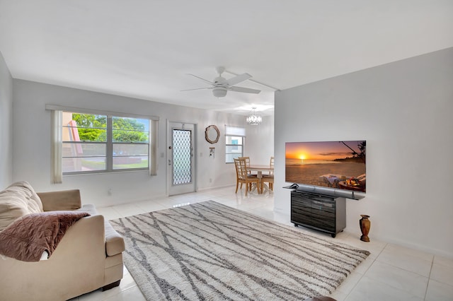 tiled living room with ceiling fan