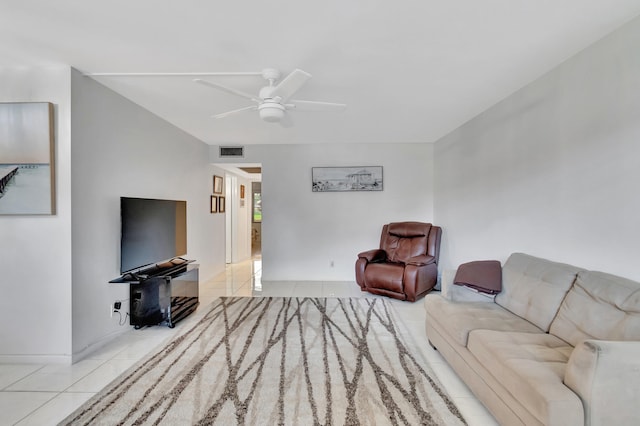 living room featuring light tile patterned flooring and ceiling fan