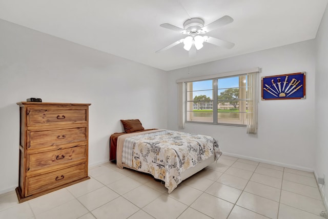 tiled bedroom with ceiling fan