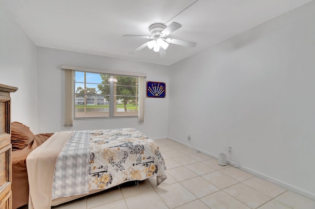 bedroom featuring light tile patterned flooring and ceiling fan