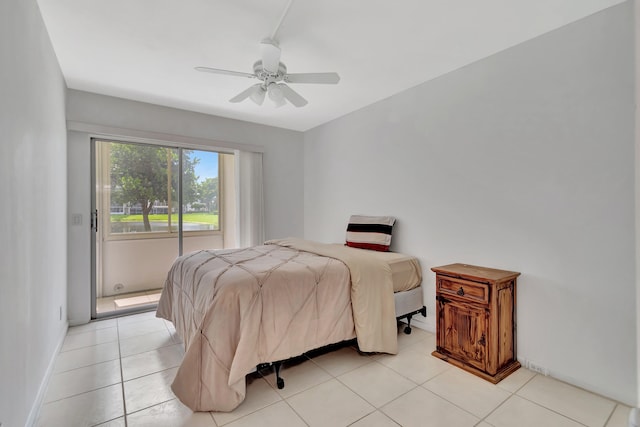 tiled bedroom featuring ceiling fan