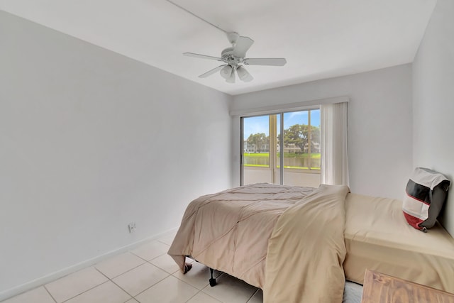 tiled bedroom with ceiling fan