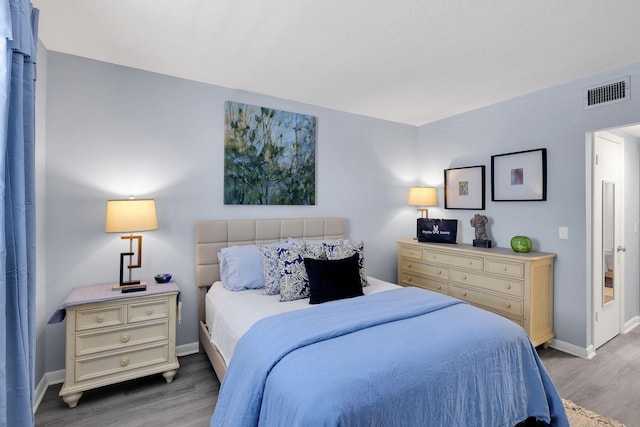 bedroom featuring wood-type flooring