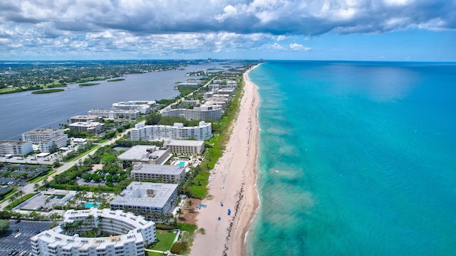 aerial view featuring a view of the beach and a water view