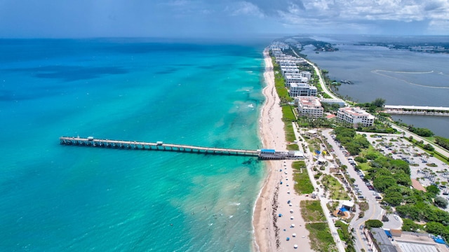 bird's eye view with a water view and a view of the beach