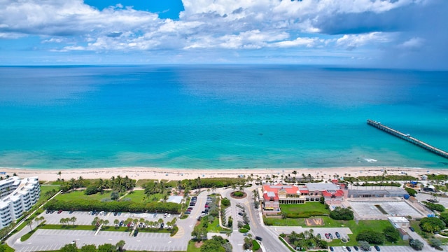 bird's eye view featuring a view of the beach and a water view