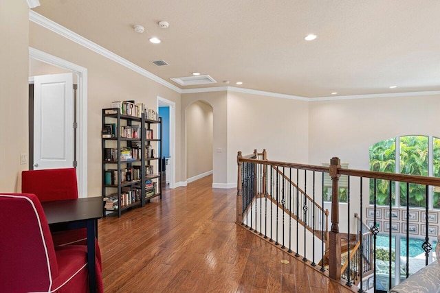 hall featuring dark hardwood / wood-style floors and crown molding