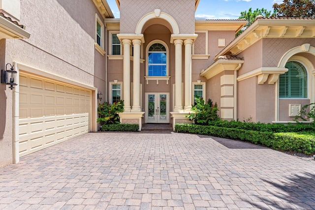 entrance to property featuring a garage