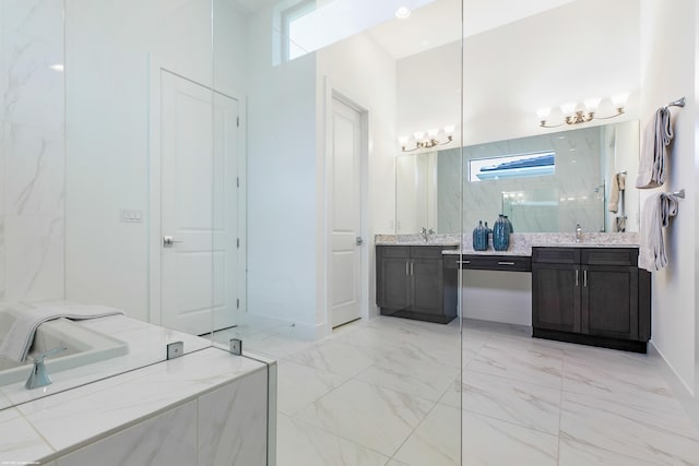 13173 Faberge Pl, Palm Beach Gardens, FL 33418 - bathroom with double vanity, marble look tiles, baseboards, a marble finish shower, and a chandelier