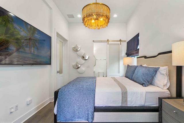 bedroom with dark wood-type flooring and a notable chandelier