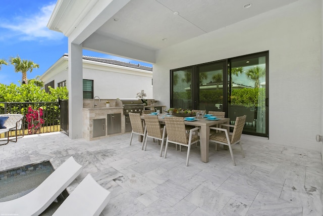 13173 Faberge Pl, Palm Beach Gardens, FL 33418 - view of patio with outdoor dining area and a sink