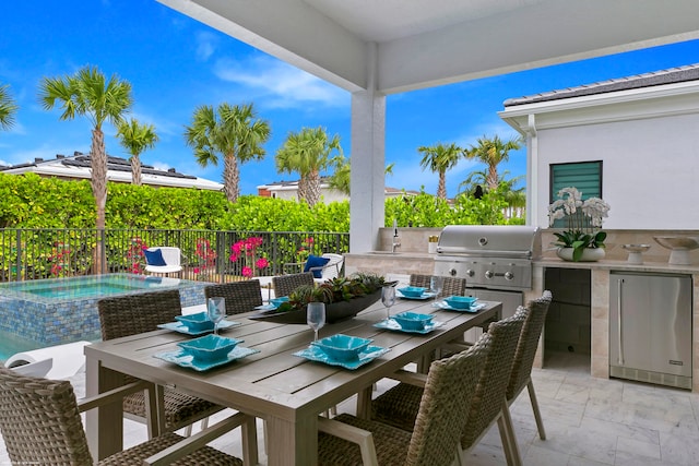 view of patio / terrace with an in ground hot tub, grilling area, and area for grilling