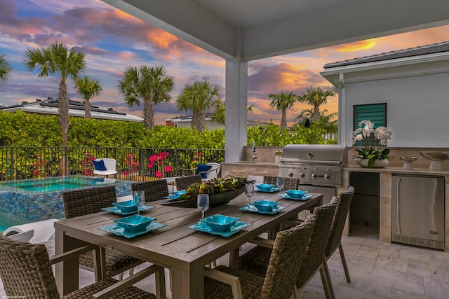 patio terrace at dusk with grilling area and area for grilling