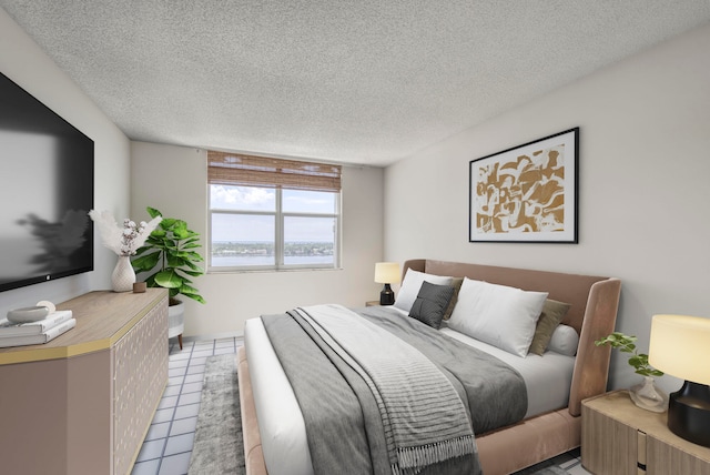 tiled bedroom with a textured ceiling