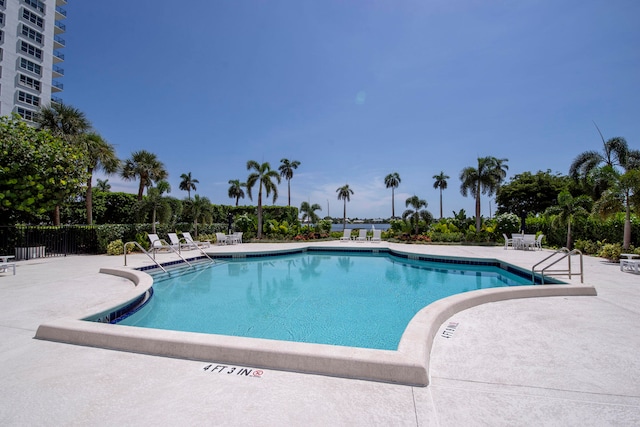 view of swimming pool featuring a patio