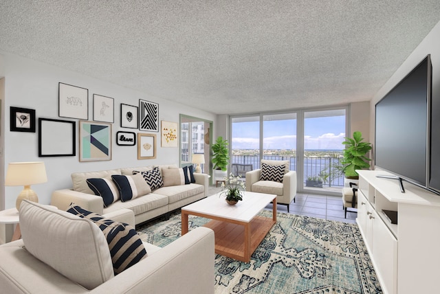 tiled living room with expansive windows and a textured ceiling