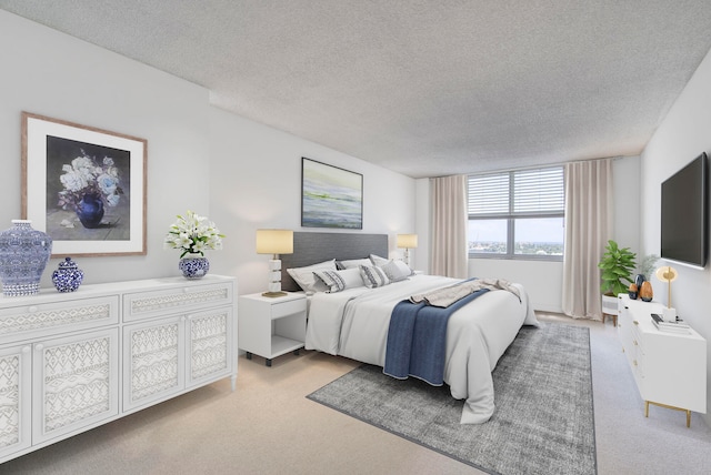 carpeted bedroom with a textured ceiling