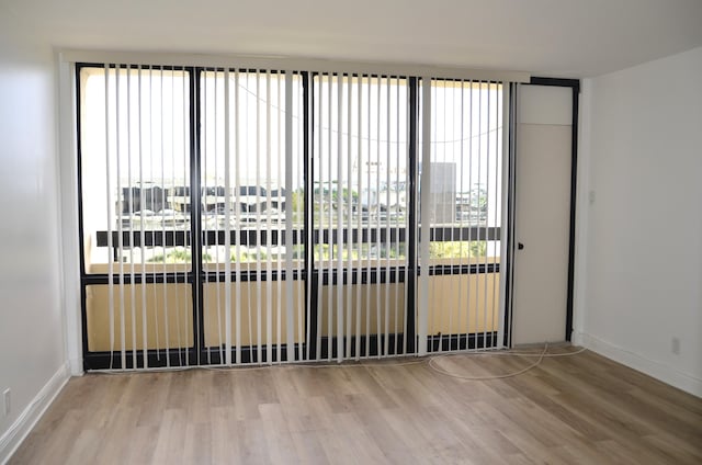 empty room featuring hardwood / wood-style flooring