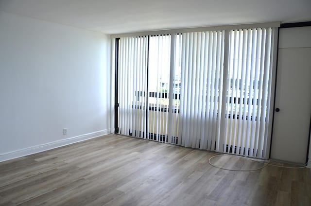 unfurnished room featuring wood-type flooring