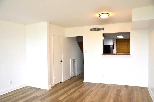 empty room featuring hardwood / wood-style floors