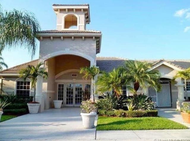 entrance to property featuring french doors