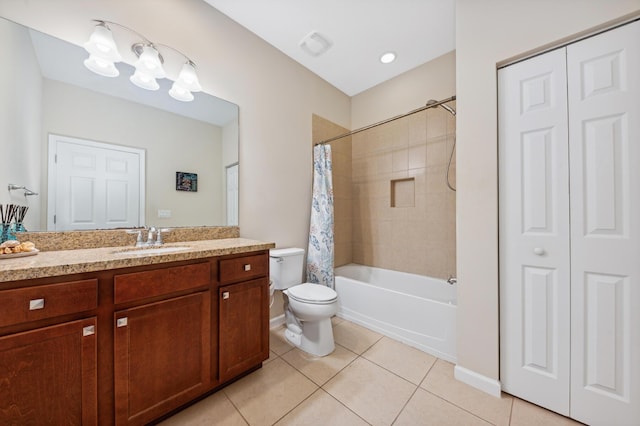 full bathroom featuring tile patterned flooring, vanity, toilet, and shower / tub combo