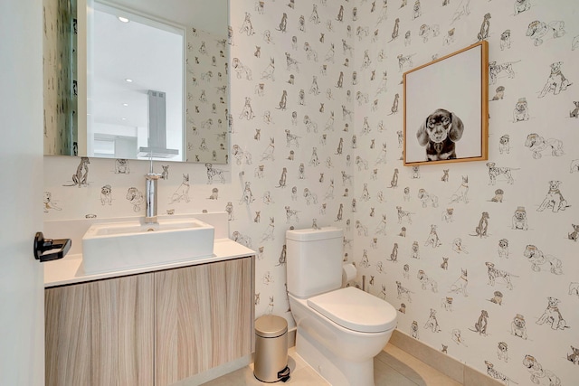 bathroom with tile patterned floors, toilet, and vanity